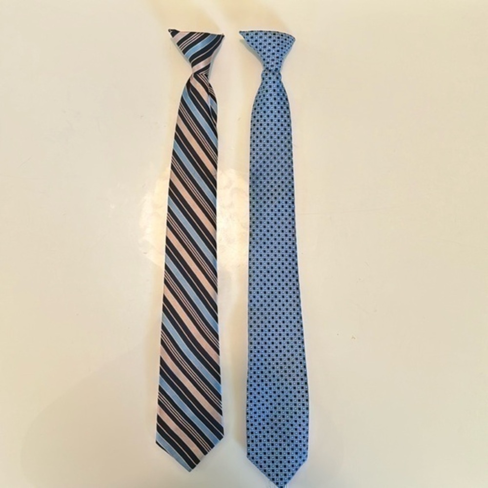 Two boys clip-on ties, blues and pinks